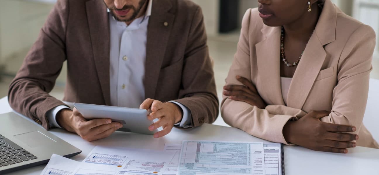A pair of businessmen analyzing documents.