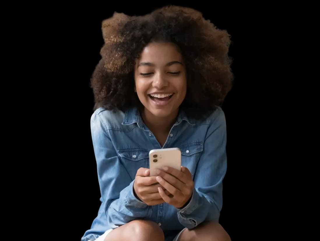 Woman sitting on sofa looking at phone