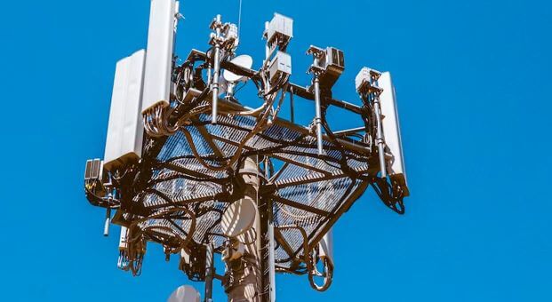 Cellphone tower against a blue sky